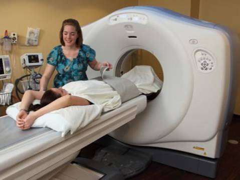 CT scanner patient preparation in progress