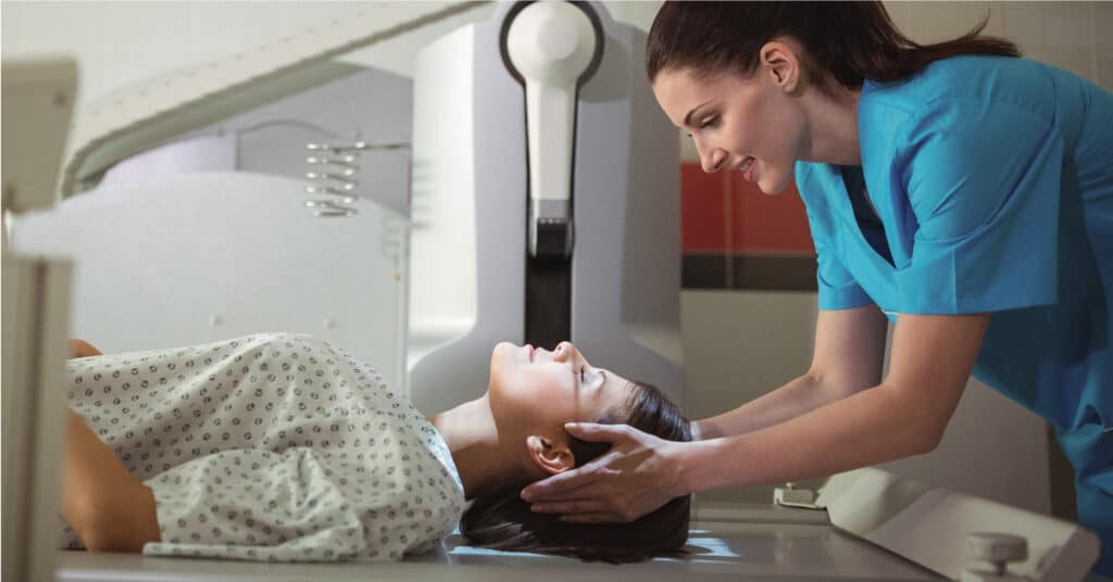 rad room in use by patient scanning head