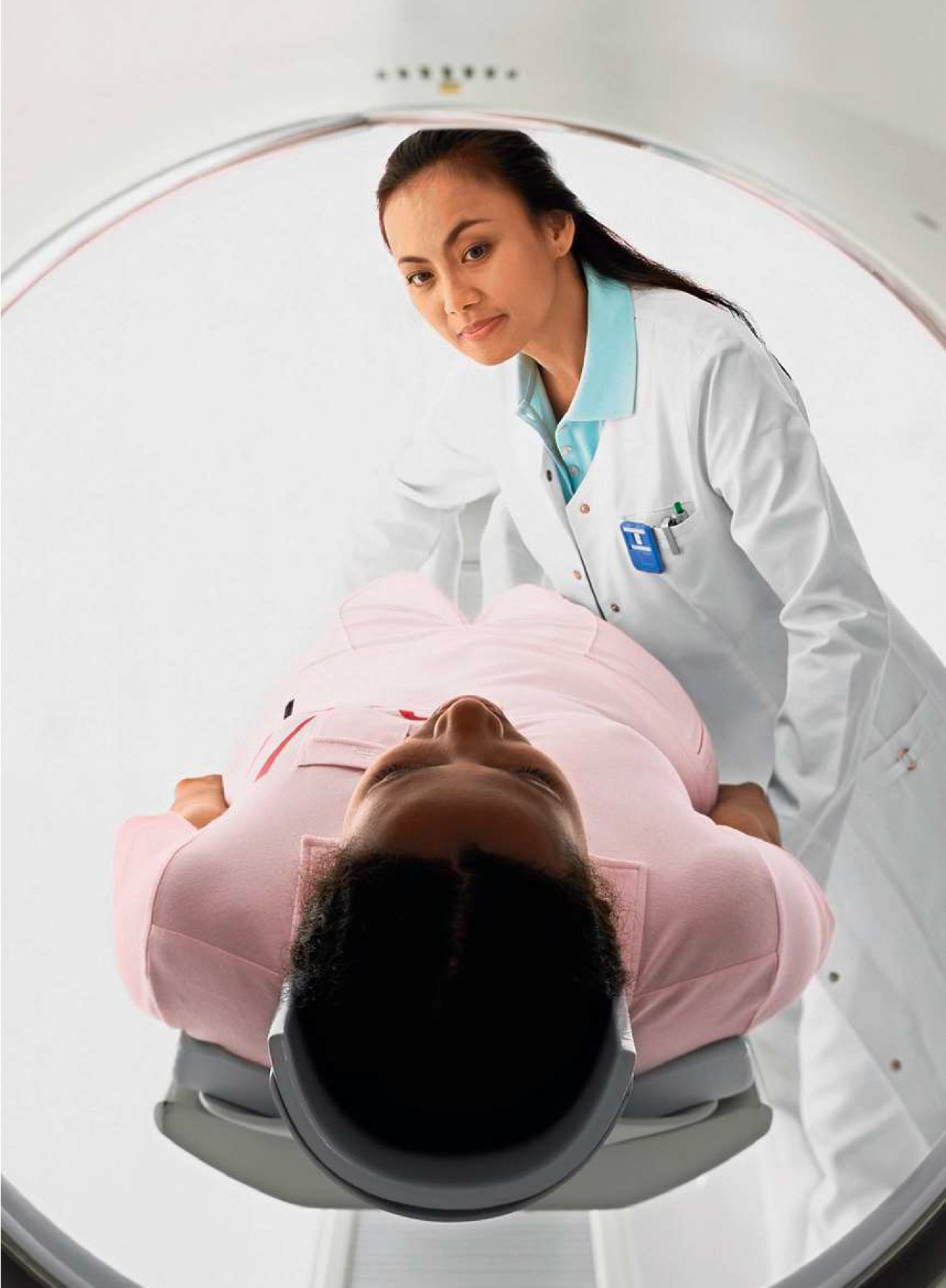 Technologist positioning a patient for a CT examination