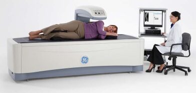 Patient having a bone density scan on a GE Lunar DEXA system