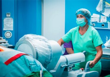 Surgical team using C-arm fluoroscopy in the operating room